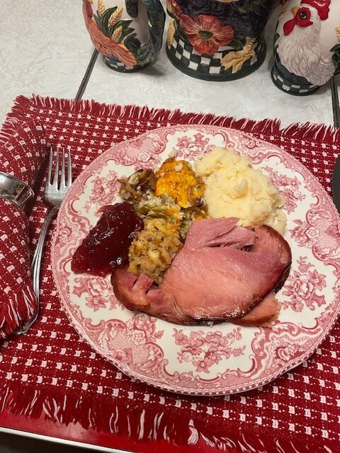dinner plate with ham, mashed potatoes